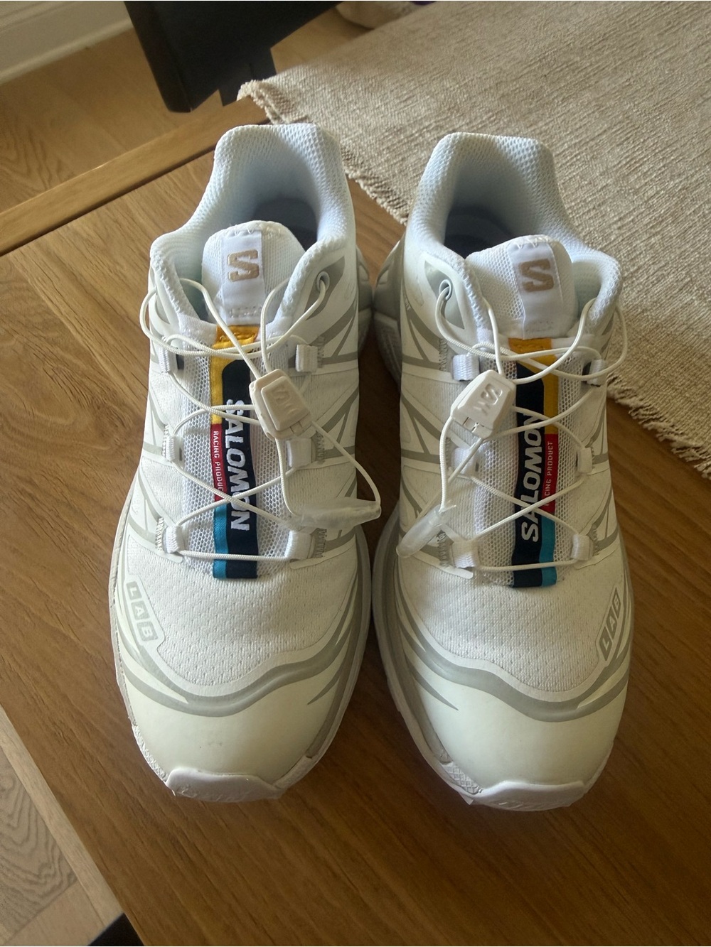 Salomon White Athletic Shoes with Blue and Yellow Accents